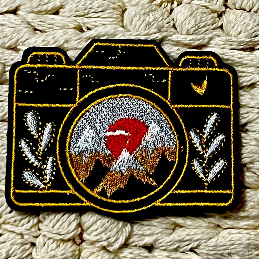 Cute camera with mountain patch
